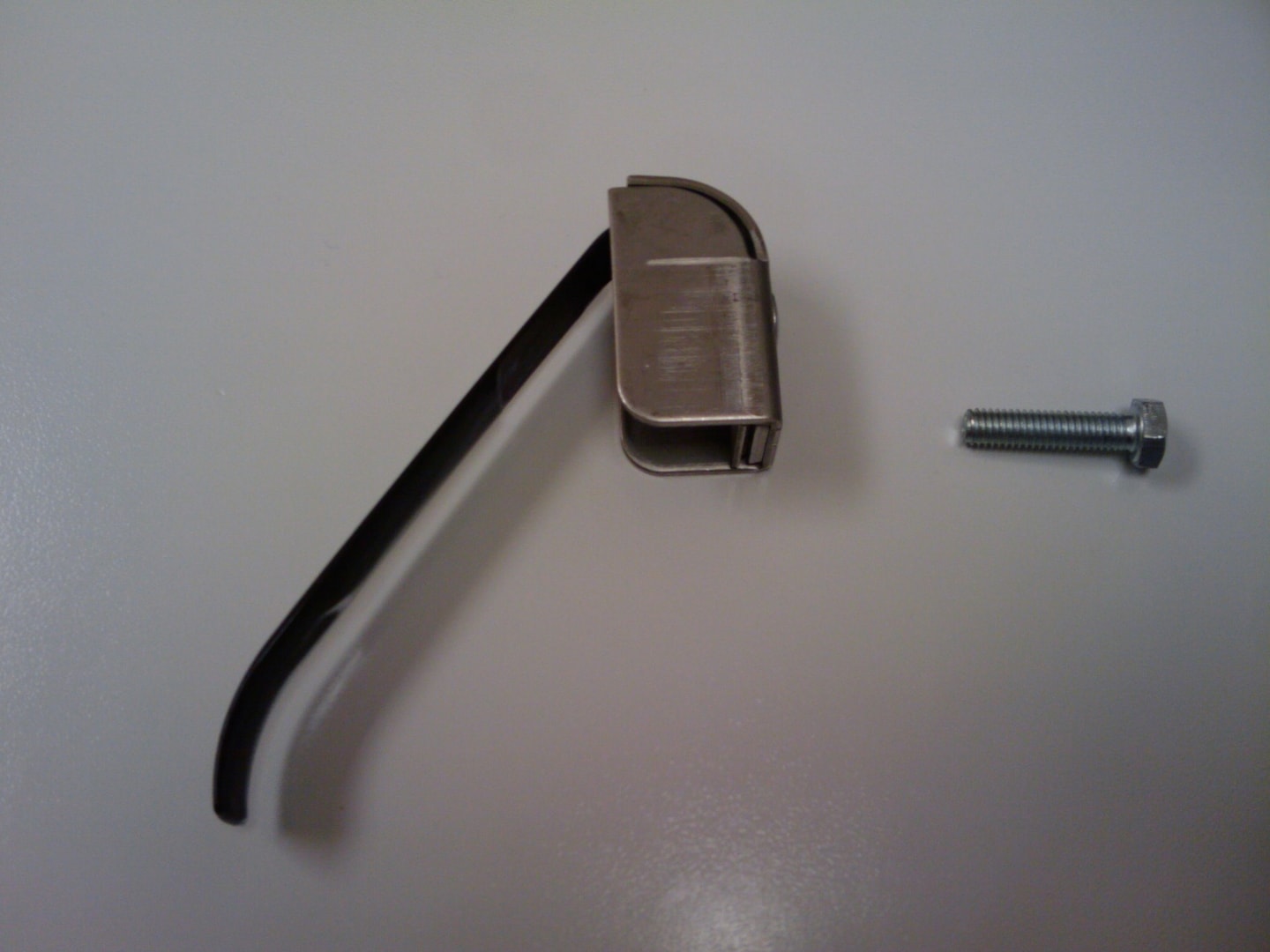 Close-up of tank securing hardware bracket